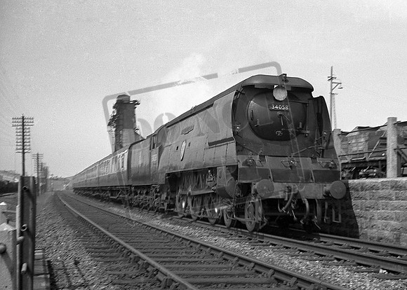 34058 1950s passing Exmouth Junction Shed